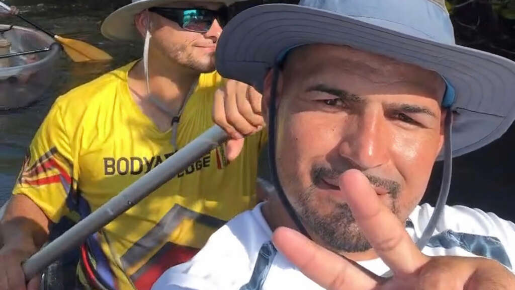 Two explorers during their 4-hour rental, navigating Boot Key Harbor's mangrove tunnels.