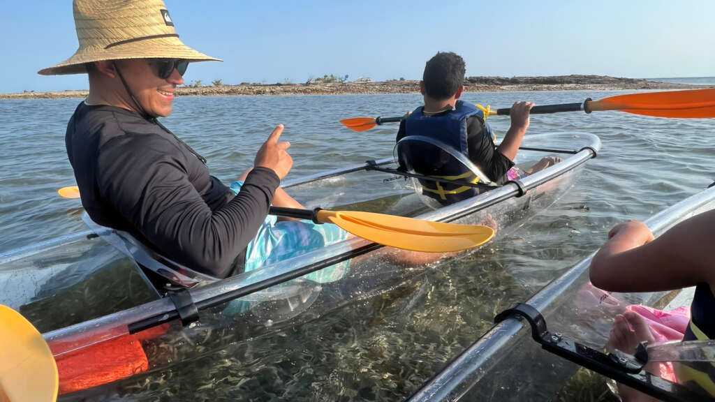 Family exploring Sombrero Flat in Gorilla Boats tandem kayaks.